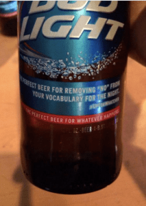 A Bud Light bottle displays the label: “The perfect beer for removing ‘no’ from your vocabulary.”